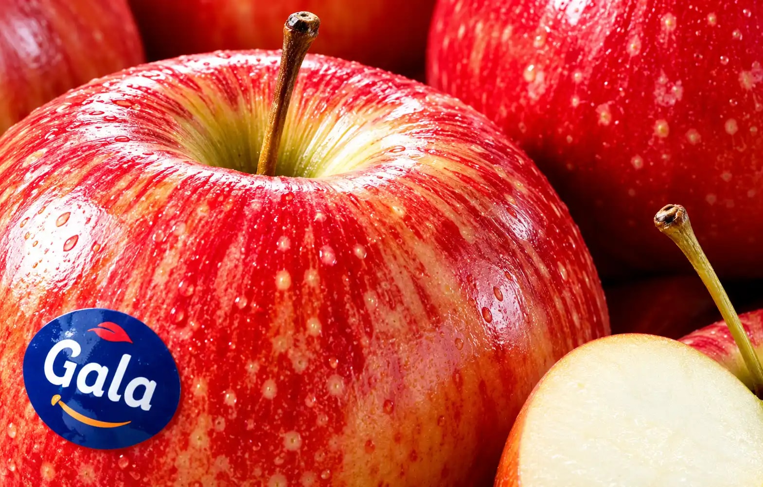 Glossy Royal Gala apples covered in moisture droplets